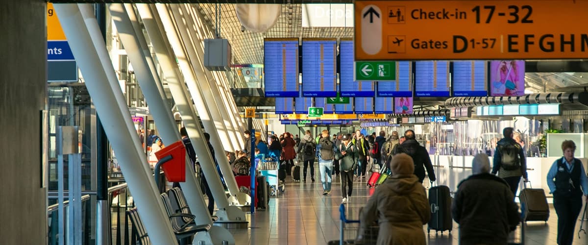 People walking through airport terminal