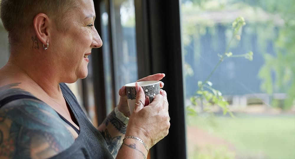 A person enjoying a cup of coffee