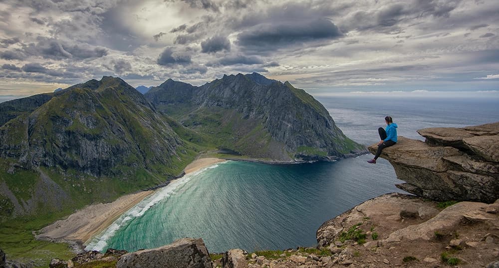 Traveler enjoying the view of a beach in Norway.