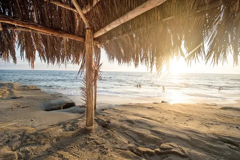 View from under a beach bungalow, looking out at the ocean