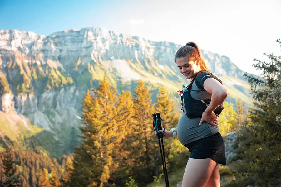 Pregnant woman hiking in the mountains