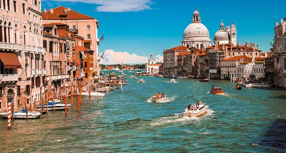 Boats on the Venice canals on a sunny day