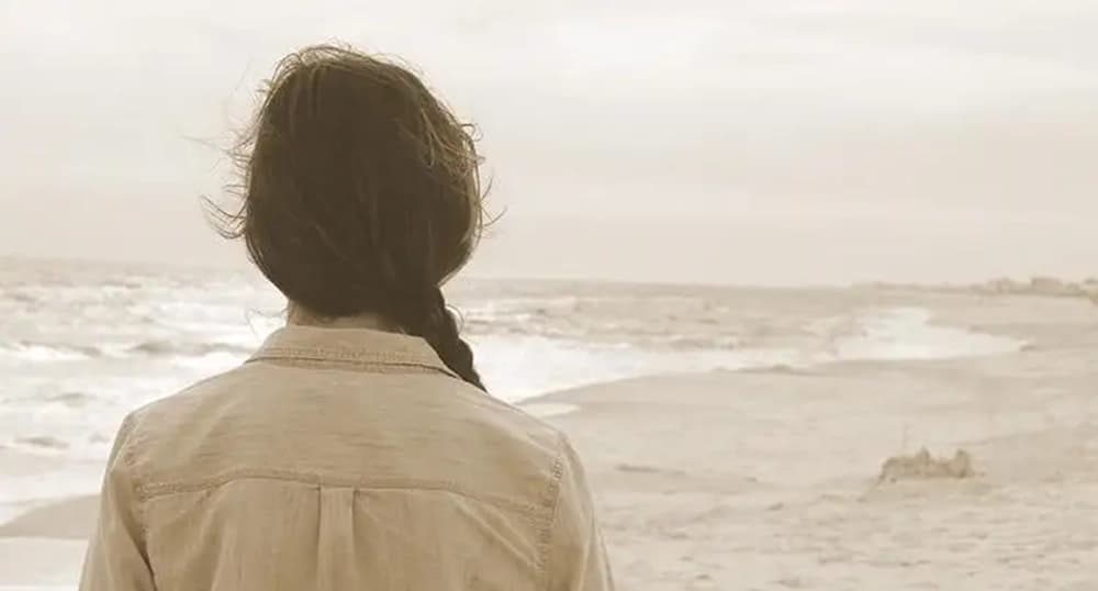 Woman walking on the beach